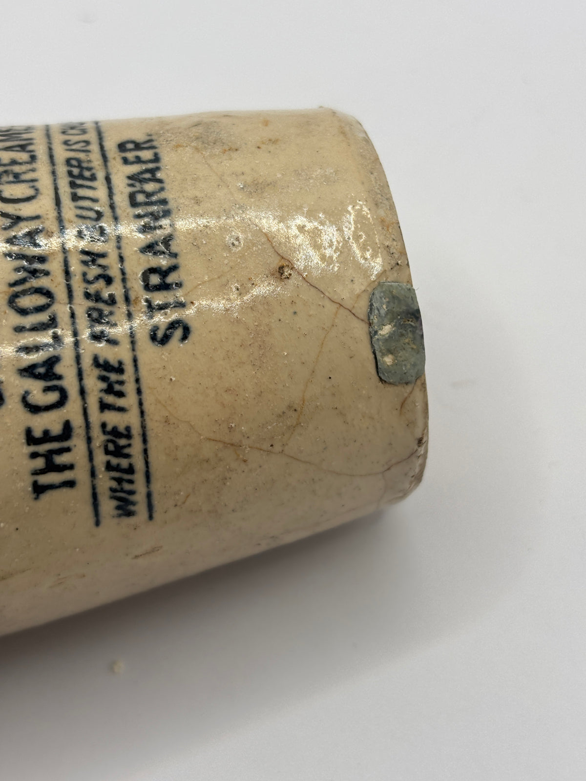Old advertising cream pot, Galloway creamery Stranraer. Filled in chip