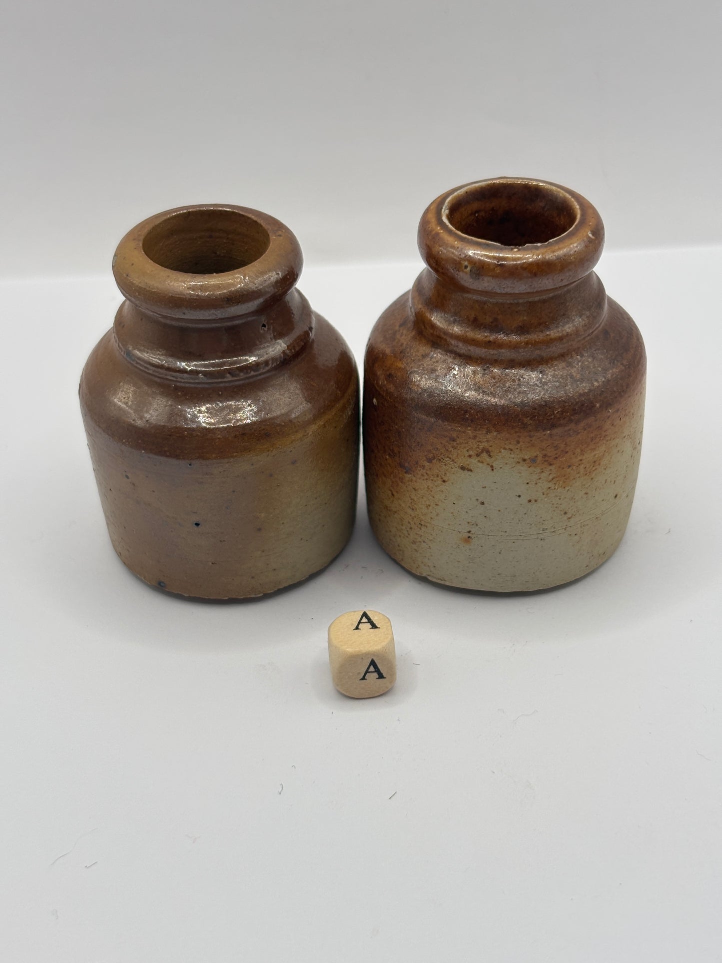 2 brown stoneware inkwells, ink bottles (a)