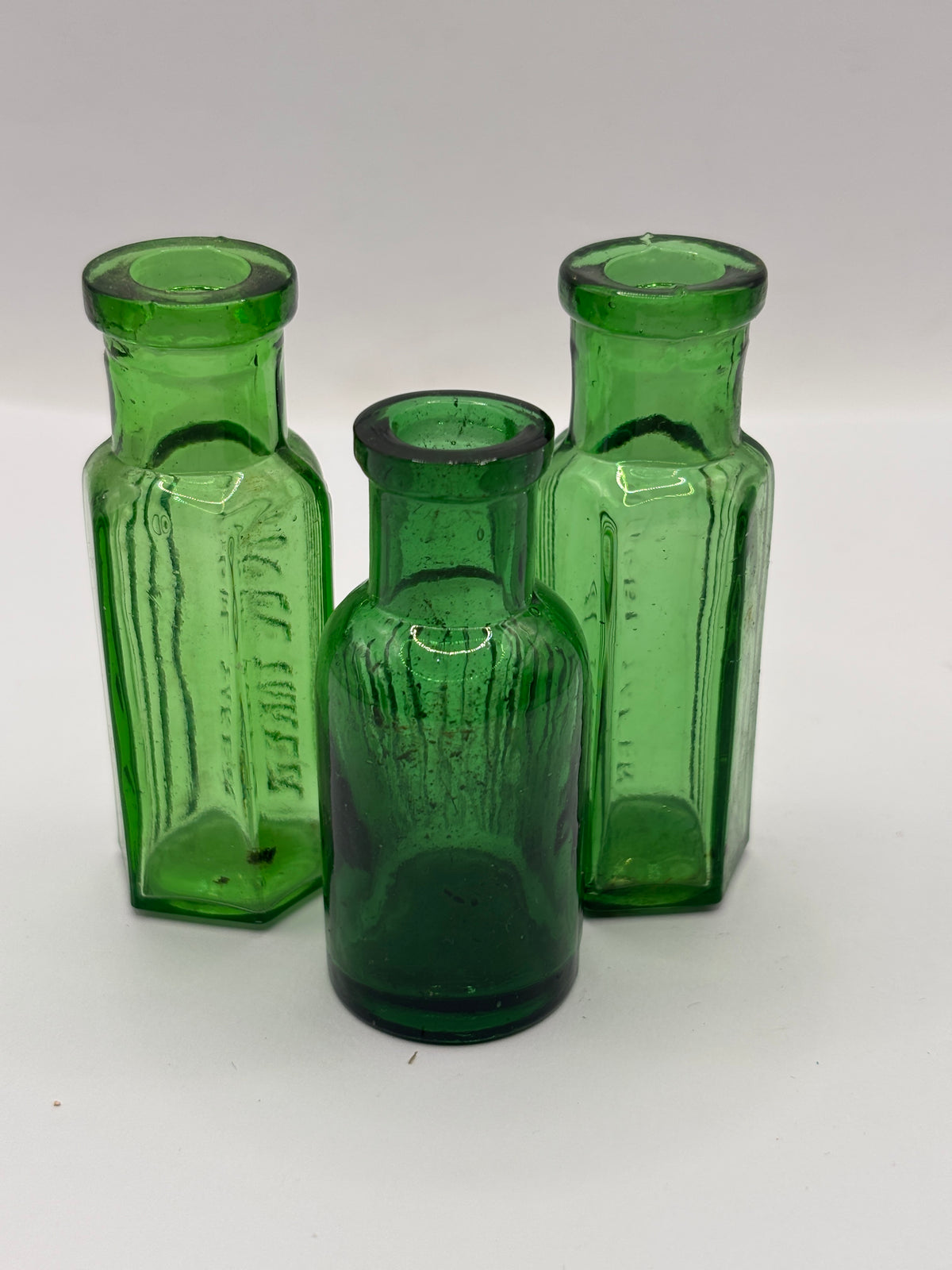 3 old small green ribbed poison bottles, not to be taken