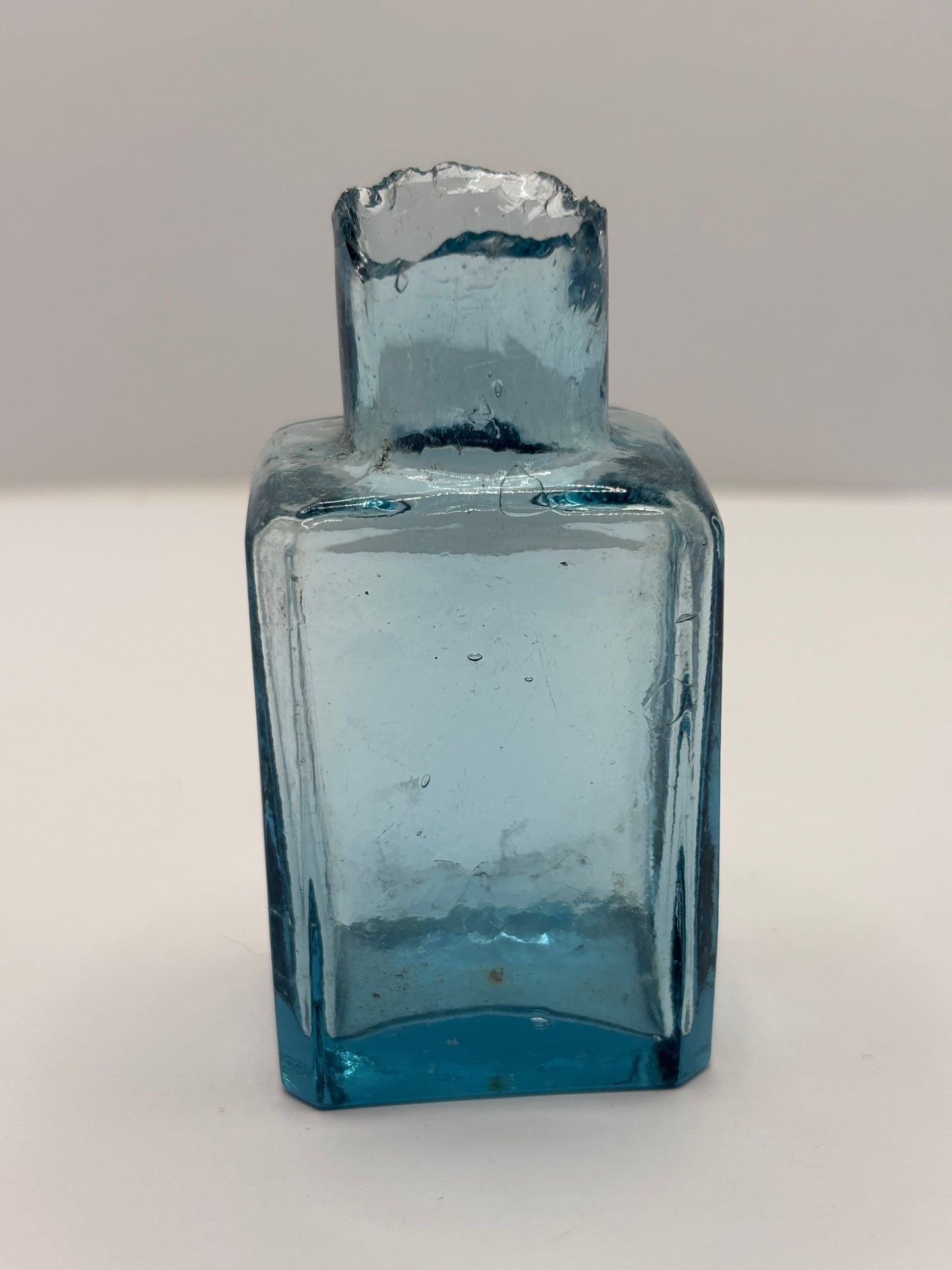 Old ice blue glass advertising ink & gum bottle, inkwell.