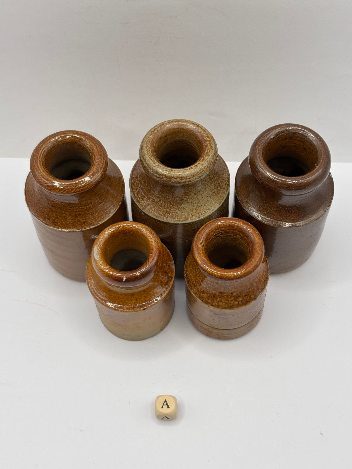 5 small brown stoneware pots (a)
