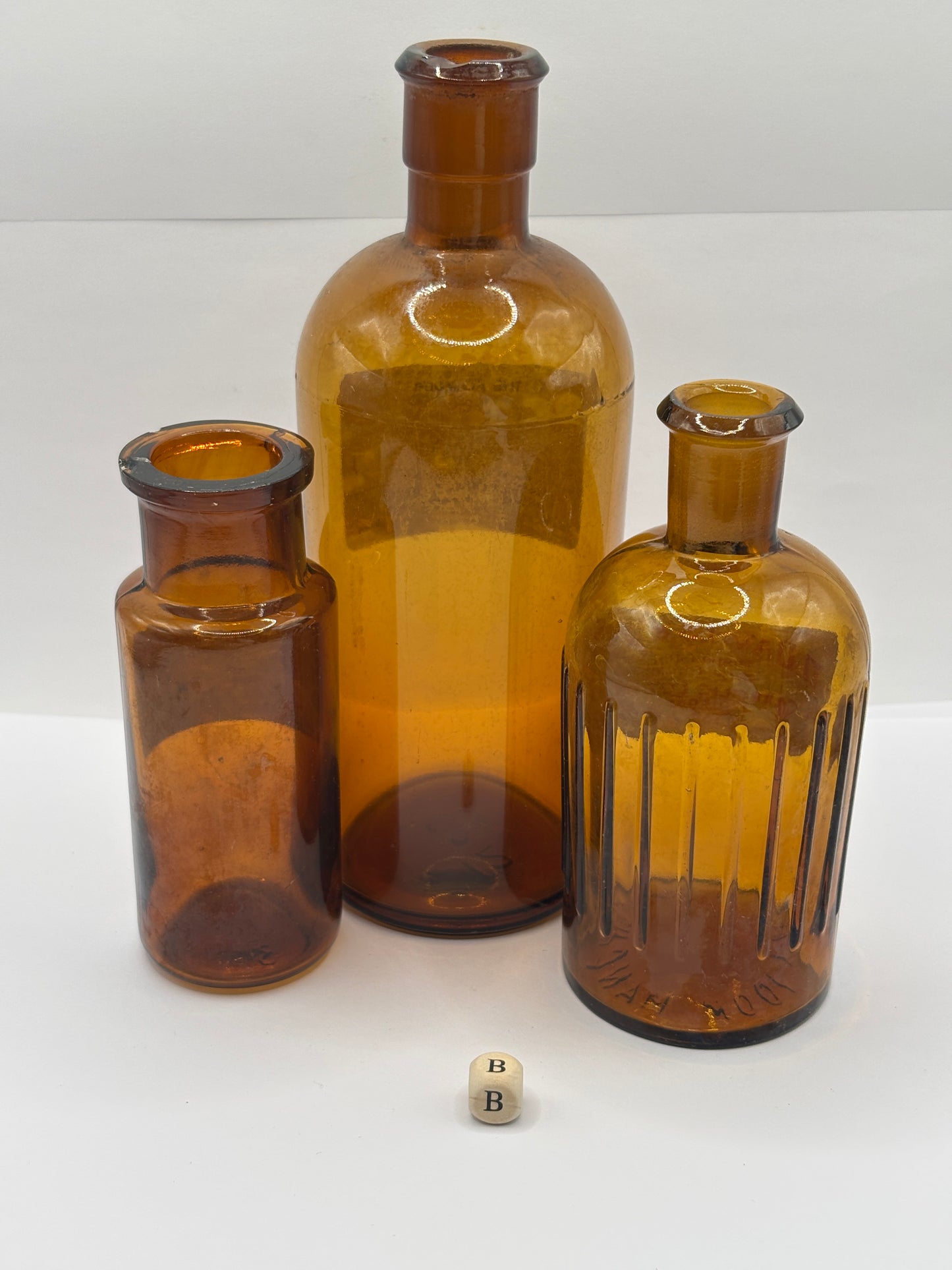 3 old chemist bottles with added labels (B)