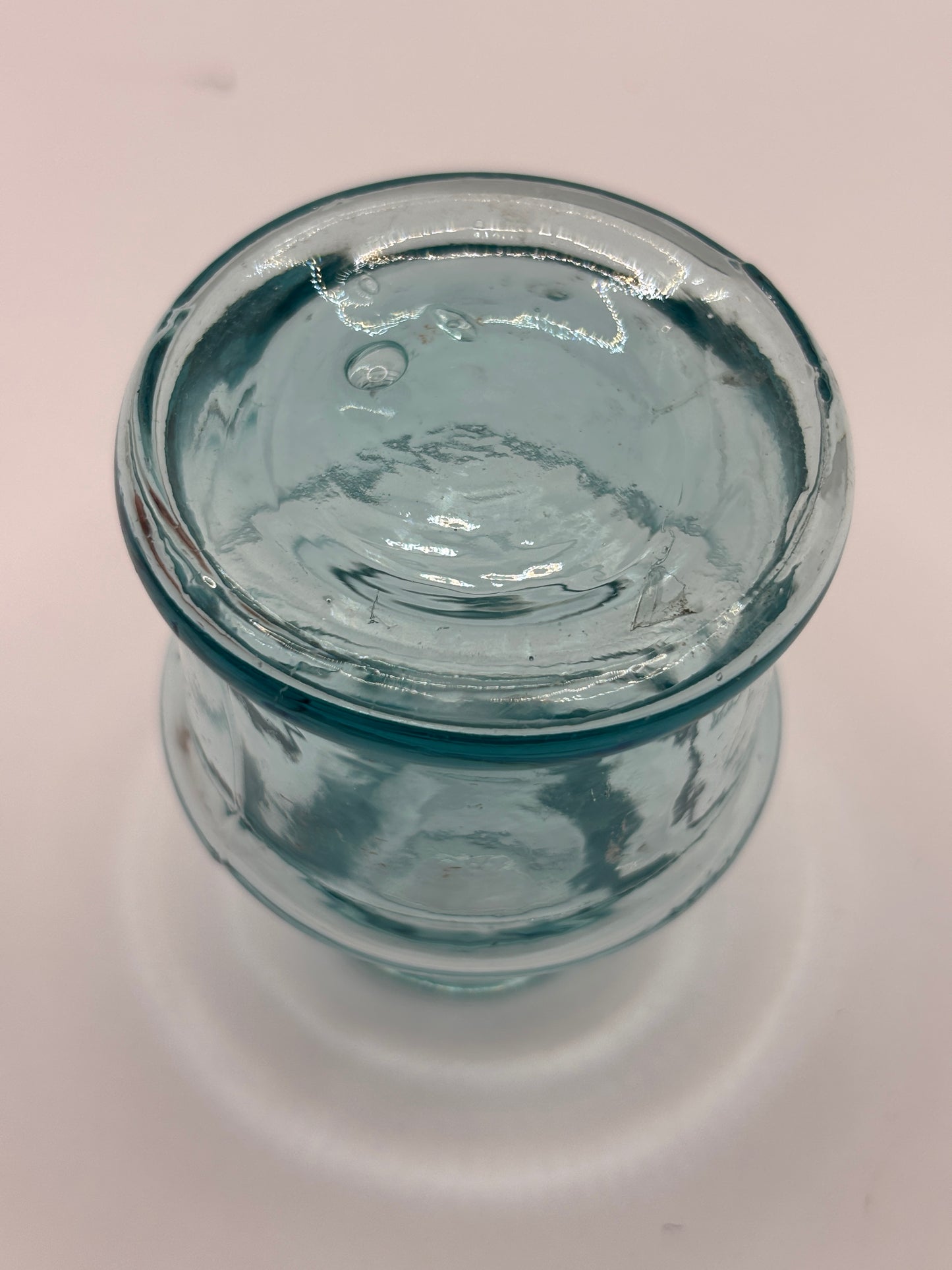 Old light blue glass inkwell, ink bottle