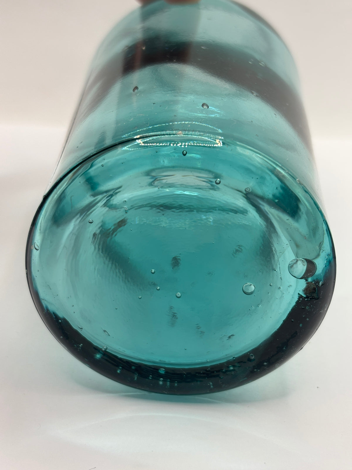 Old dark aqua glass jar