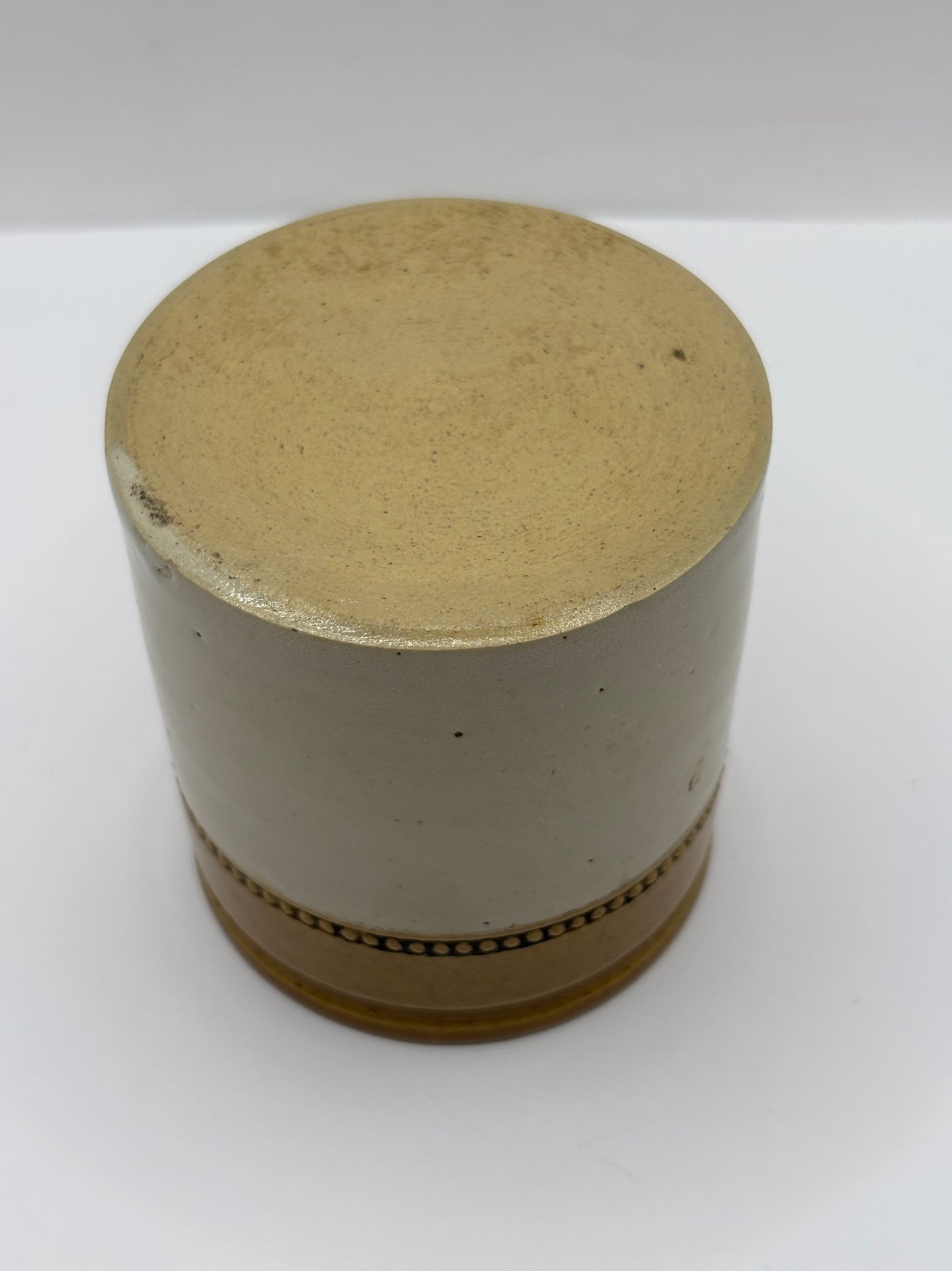 Old small brown top stoneware jar