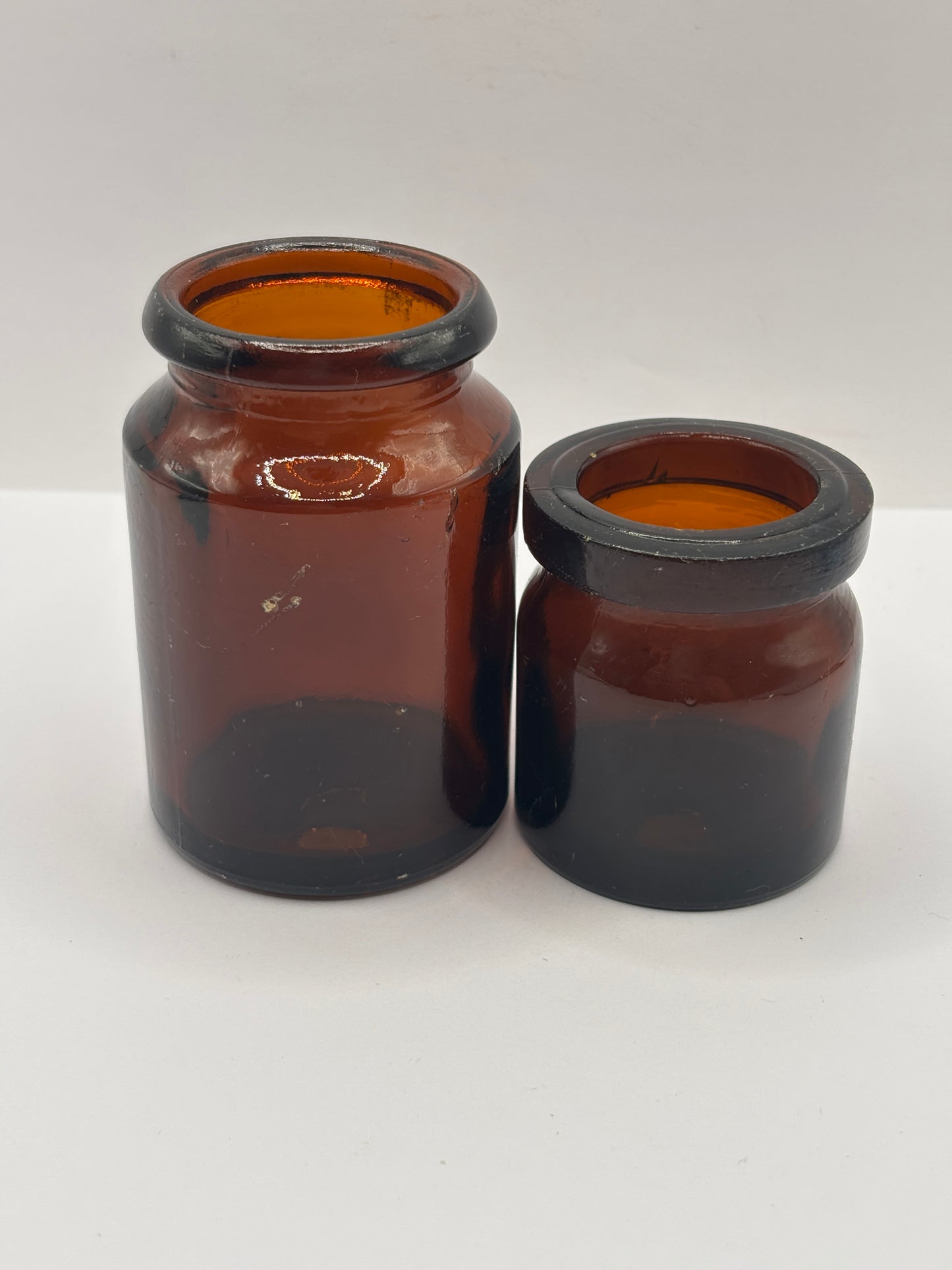 2 old amber glass jars