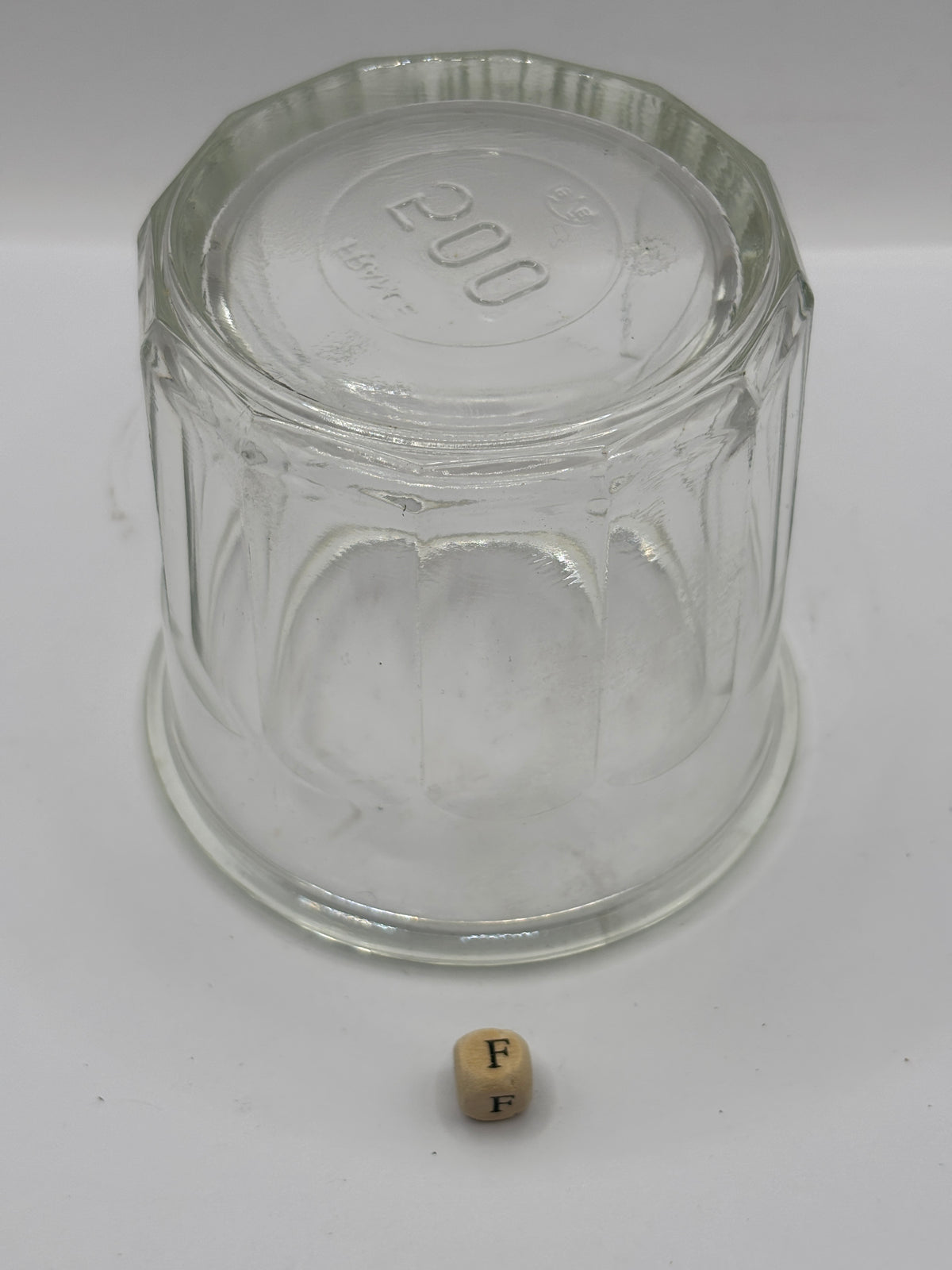 Old clear glass French jam jar (F)