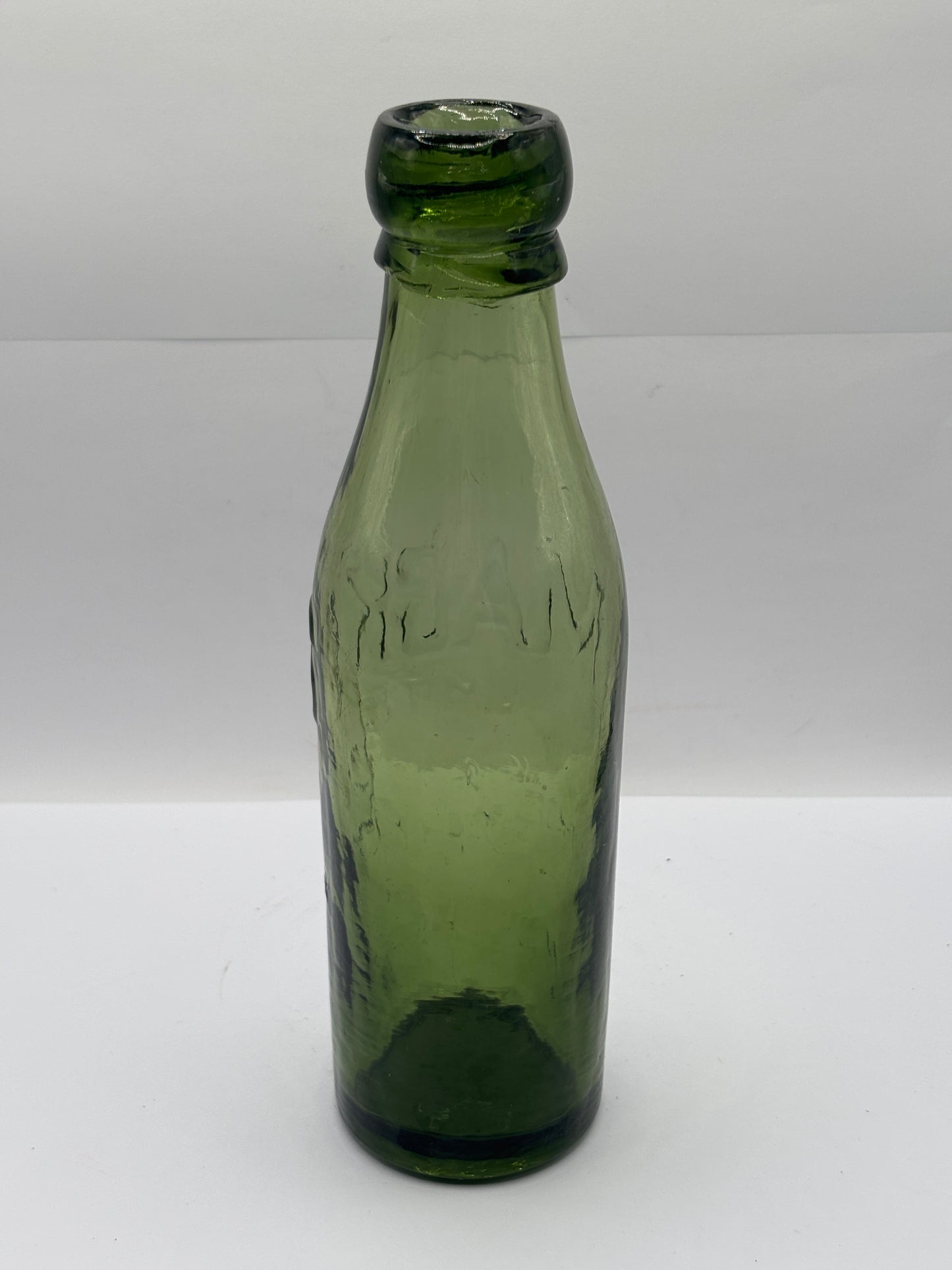 Old advertising green glass beer bottle, Macks Manchester