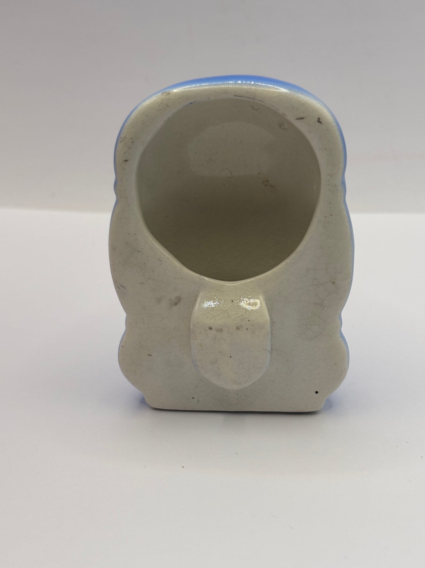 Old blue ceramic bird feeder