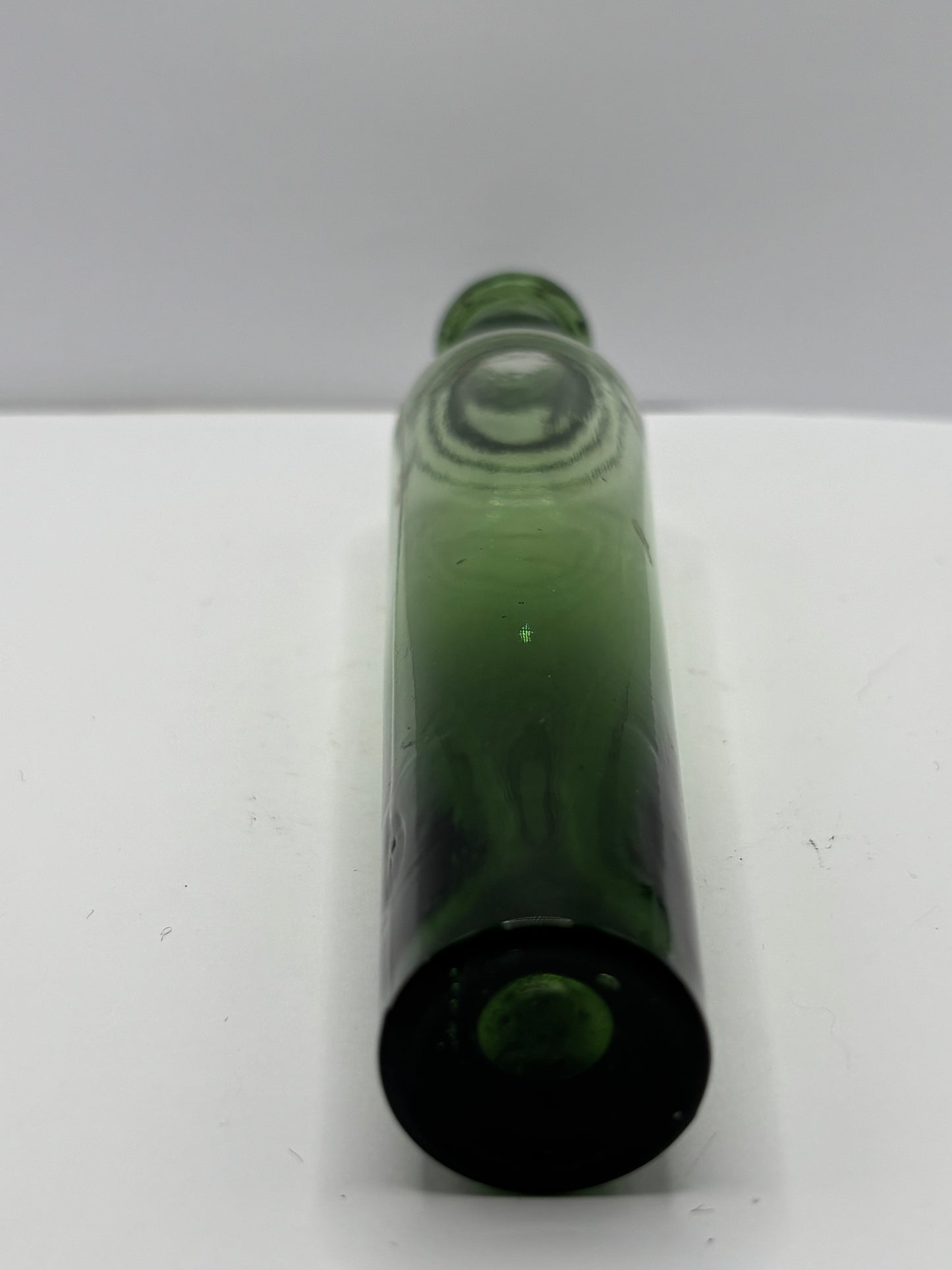 Old green glass tall lavendar water bottle