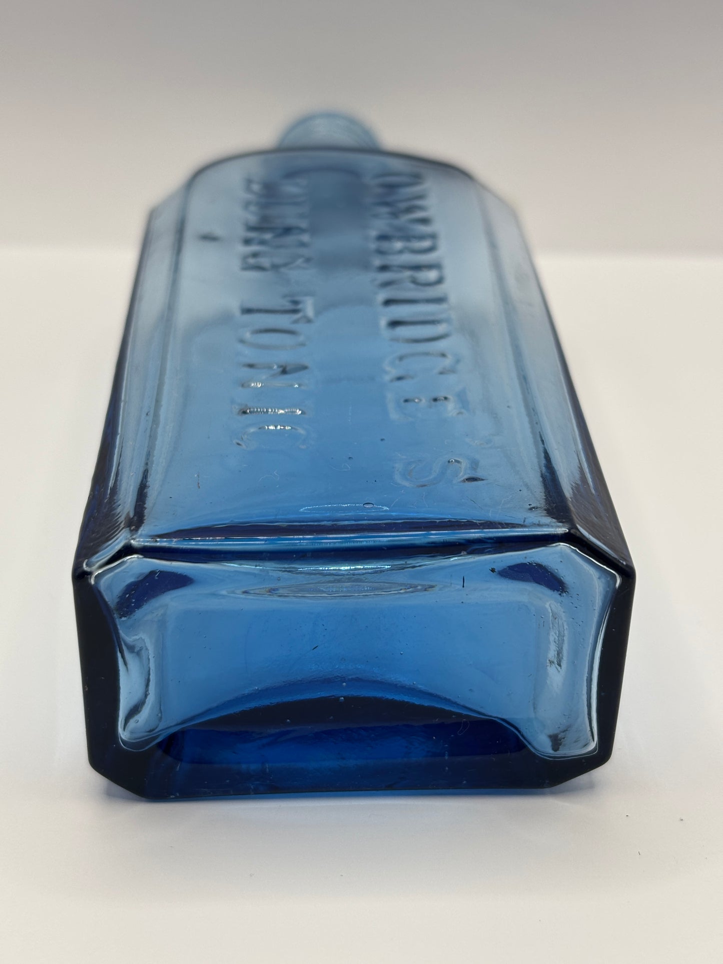 Old blue glass advertising chemist bottle, Owbridge Lung Tonic