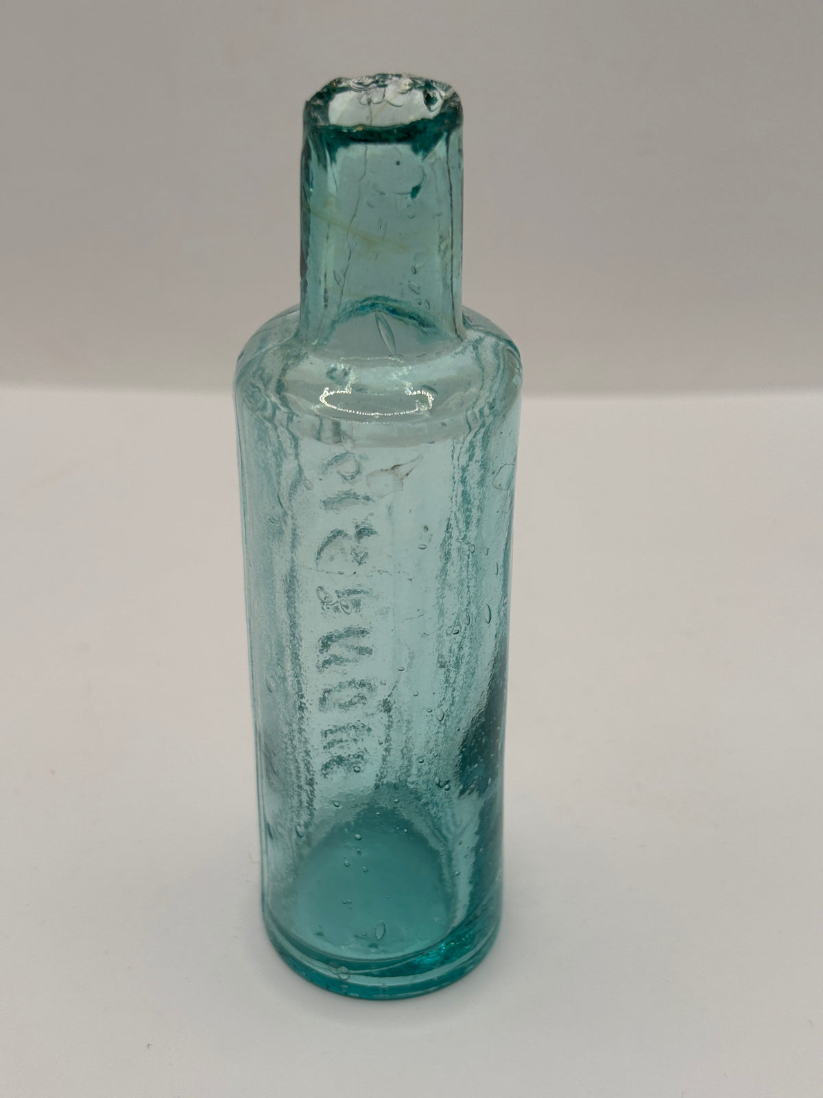 Old aqua glass poison bottle, POISONOUS not to be taken