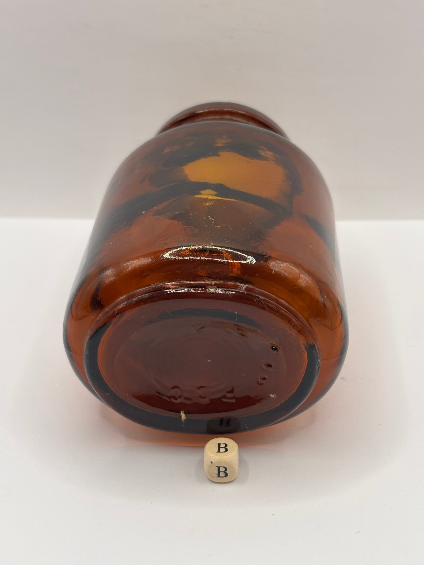 Old amber glass jar (B)