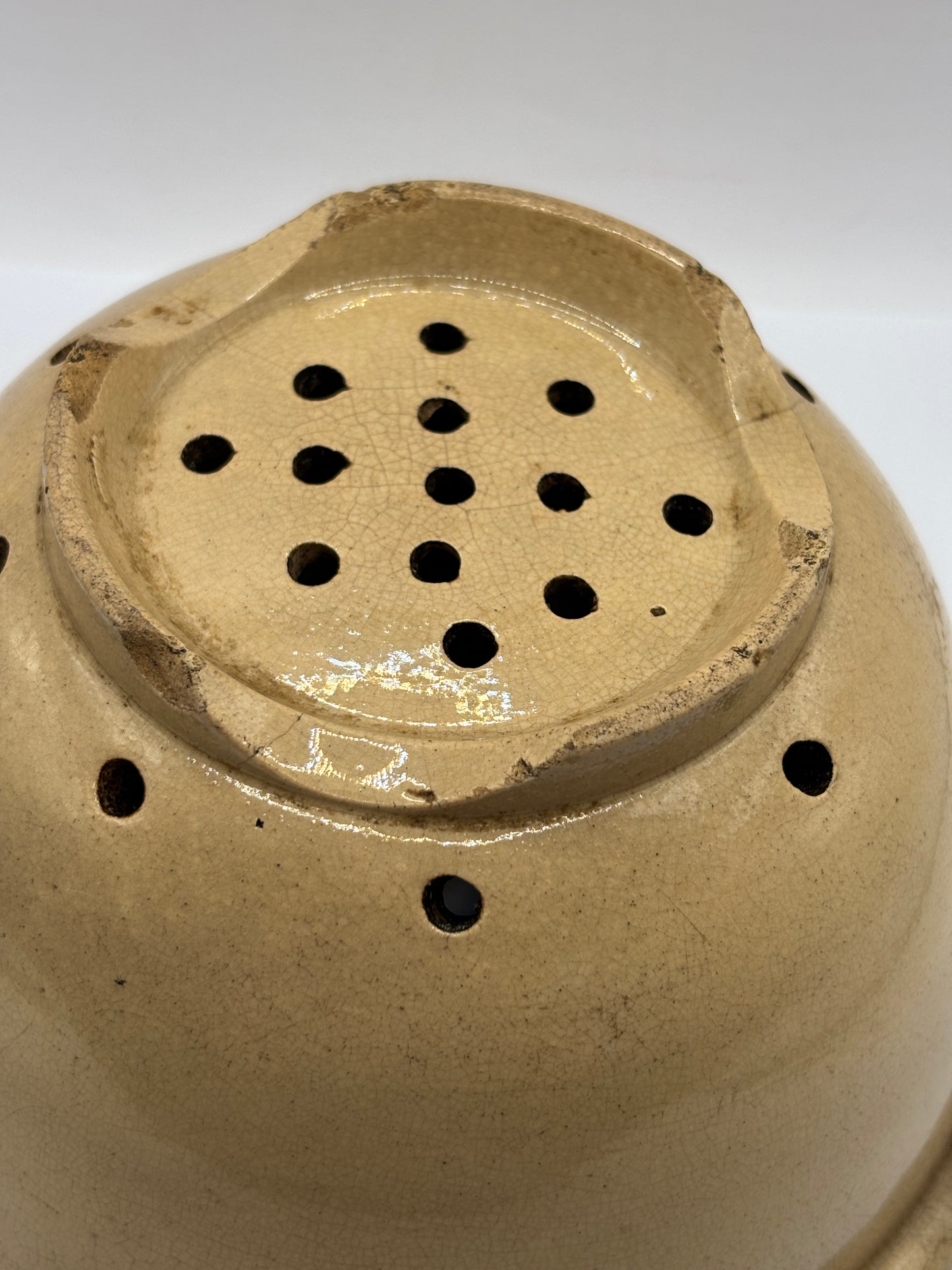 Old English stoneware strainer, crazed