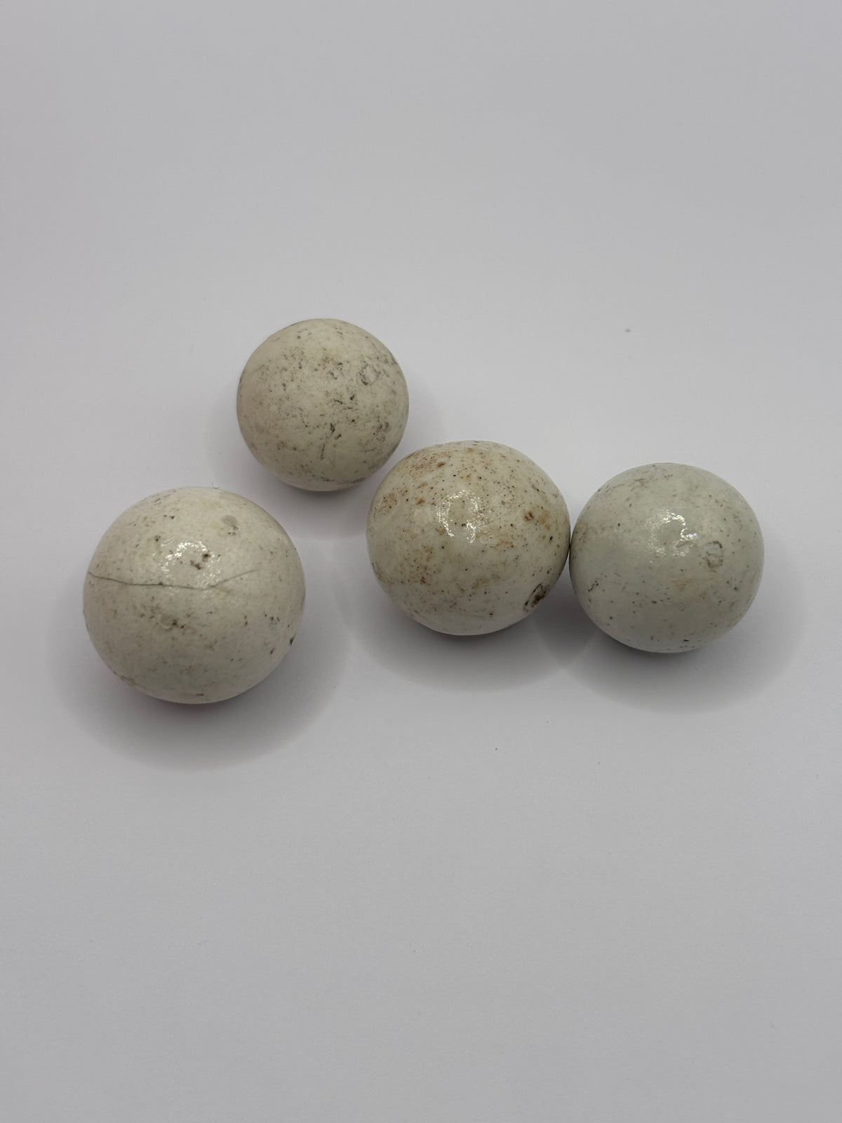 4 old clay marbles