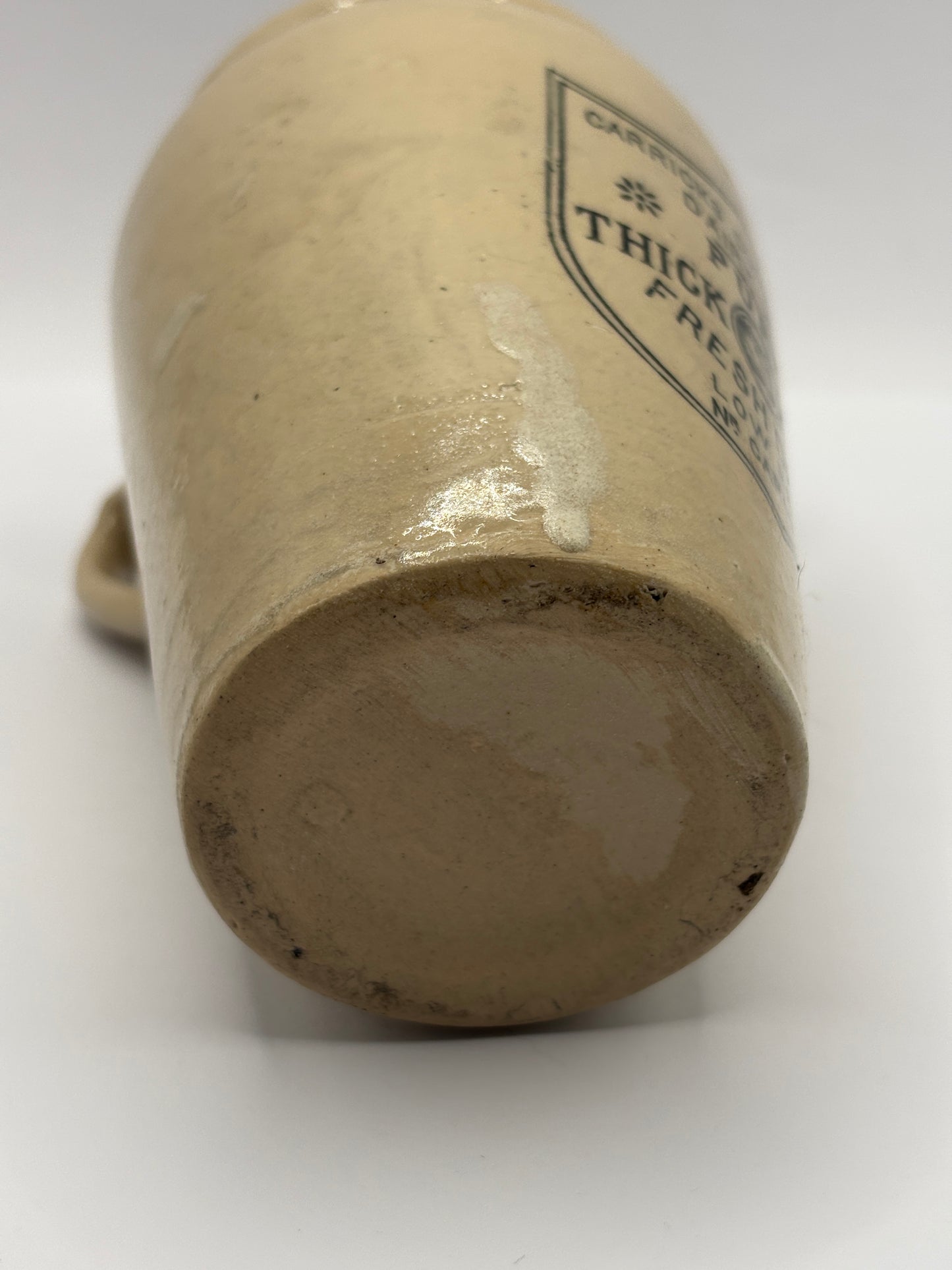 Old large advertising cream pot, Carricks pure thick cream with handle. Black print 11.5cms