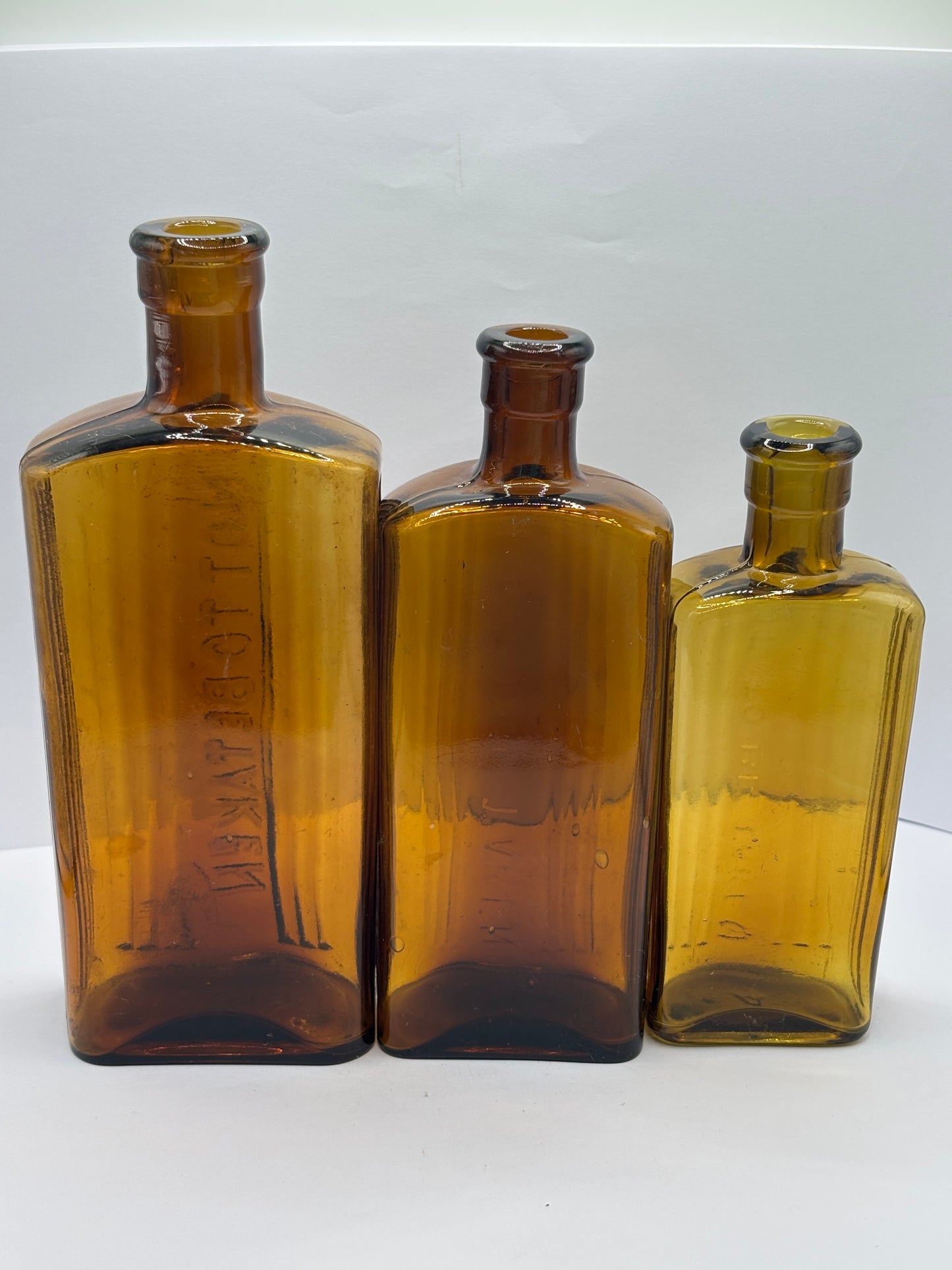 3 old amber glass poison bottles, not to be taken. Halloween