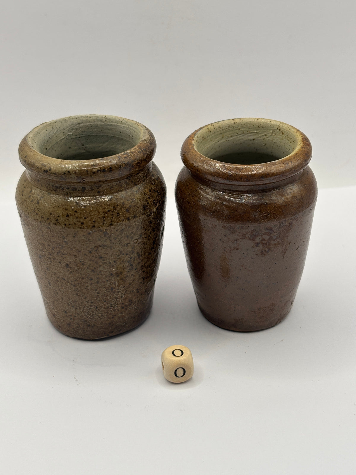 2 Old brown stoneware cream pots (o)