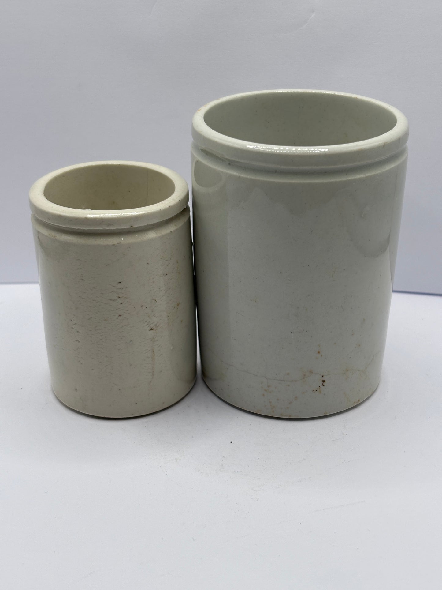 2 old white stoneware pots