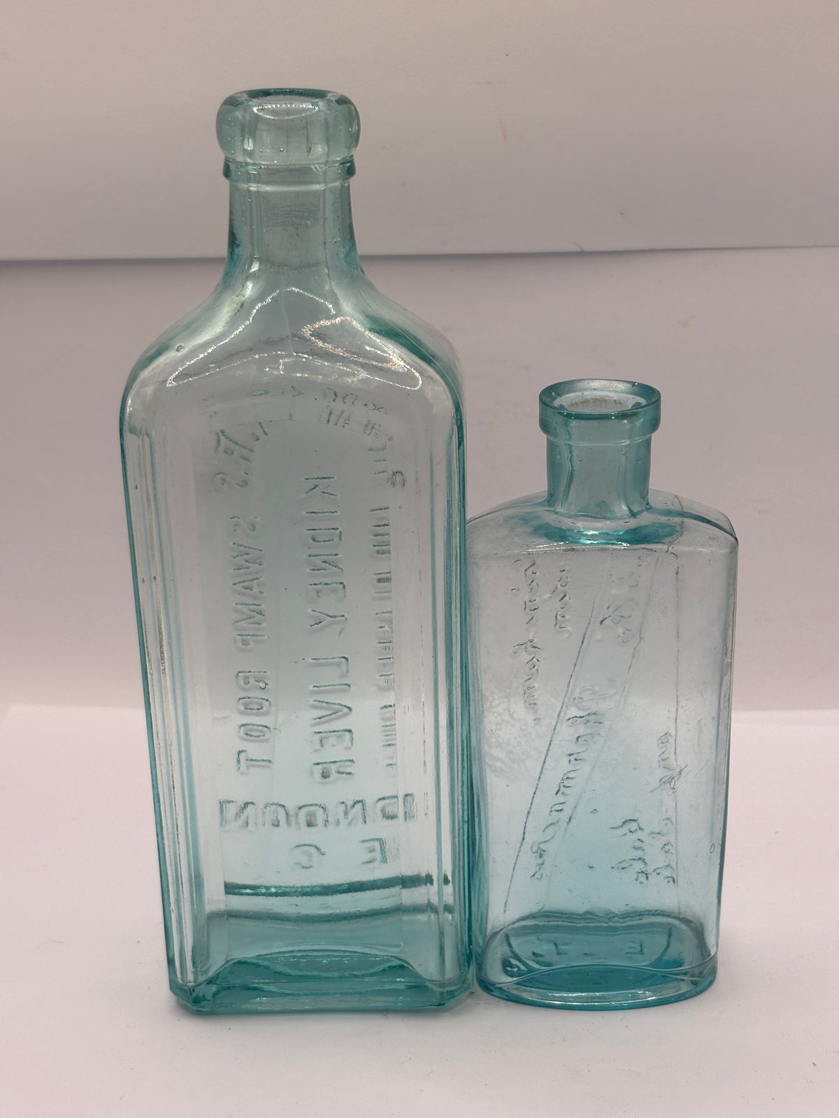 2 old advertising chemist bottles