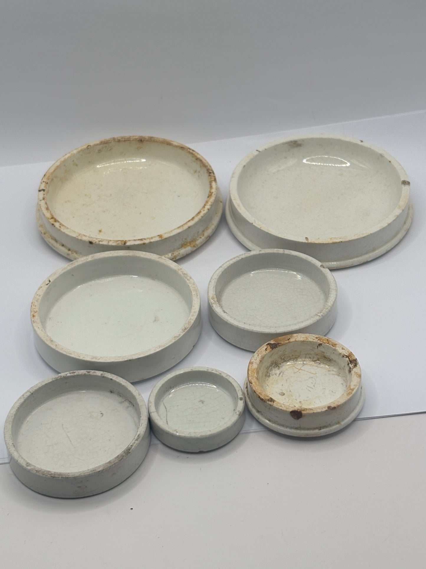 7 old plain stoneware lids, stacking lids (D)