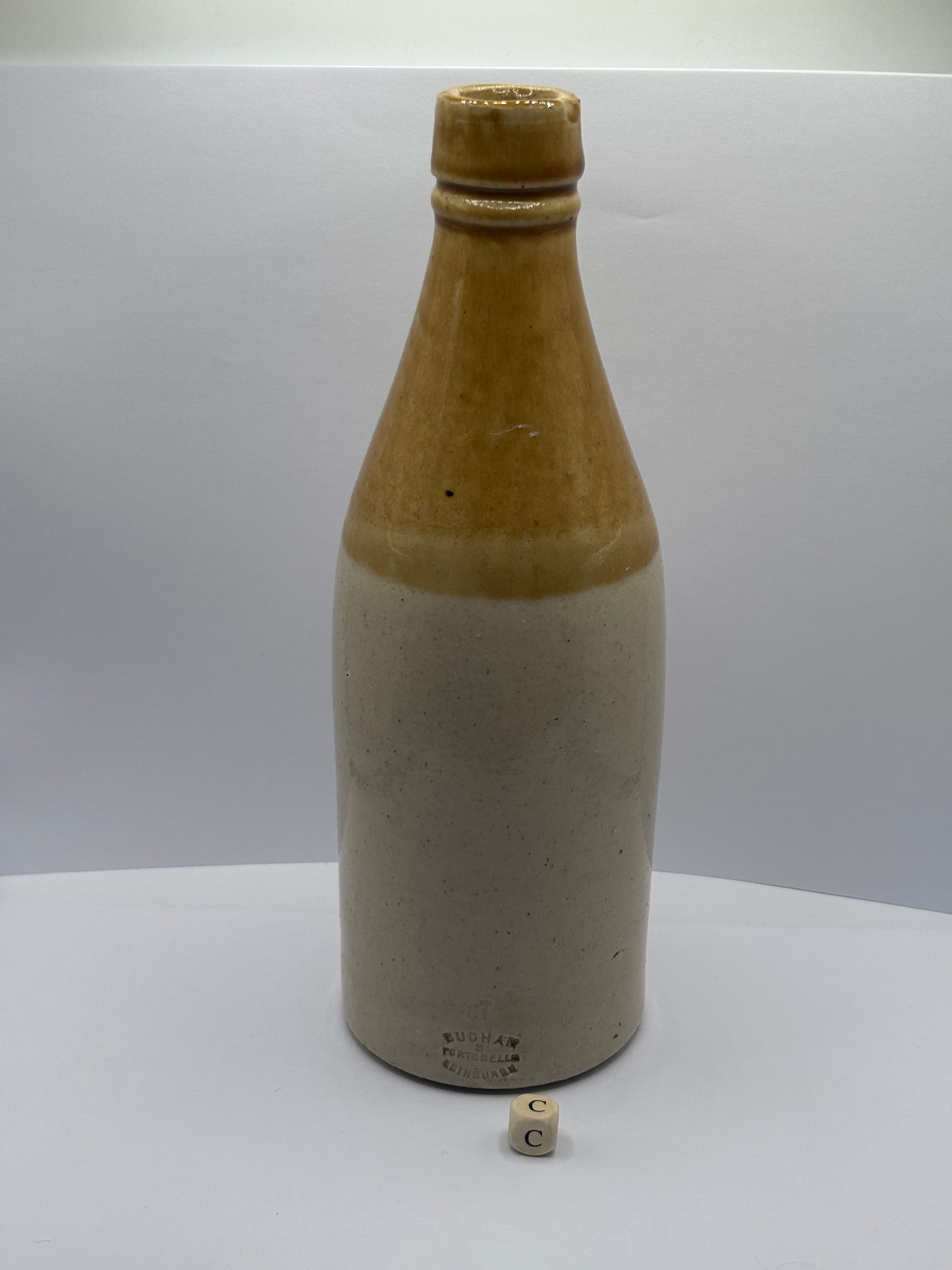 Old plain stoneware ginger beer bottle (c)