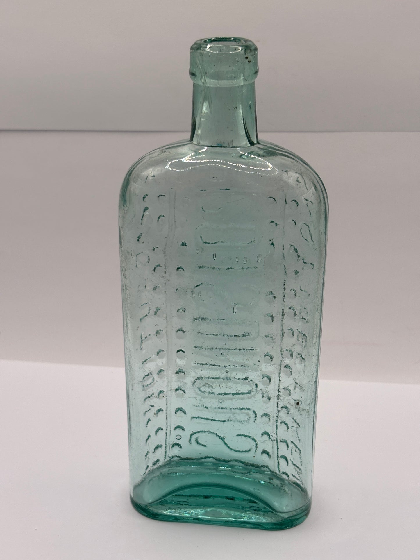 Old aqua glass poison bottle, Ammonia, caution Poisonous, not to be taken