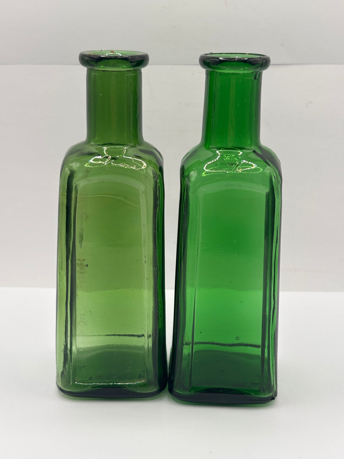 2 old green glass IZAL bottles