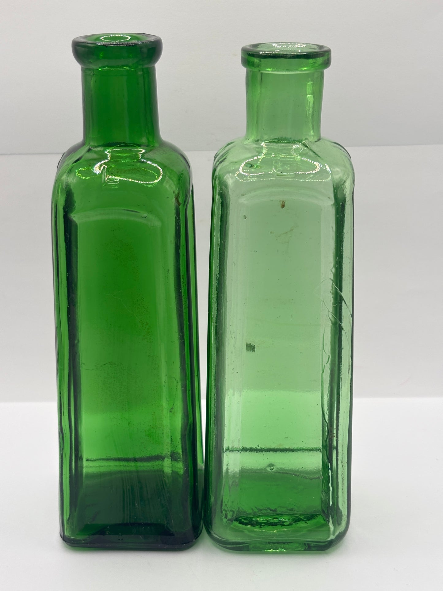 2 old green glass IZAL bottles
