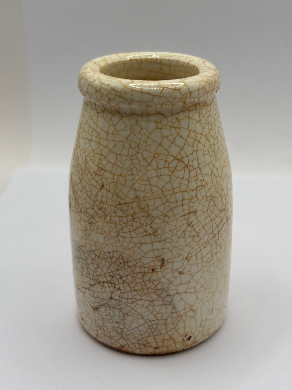 Old plain white stoneware creamer, churn