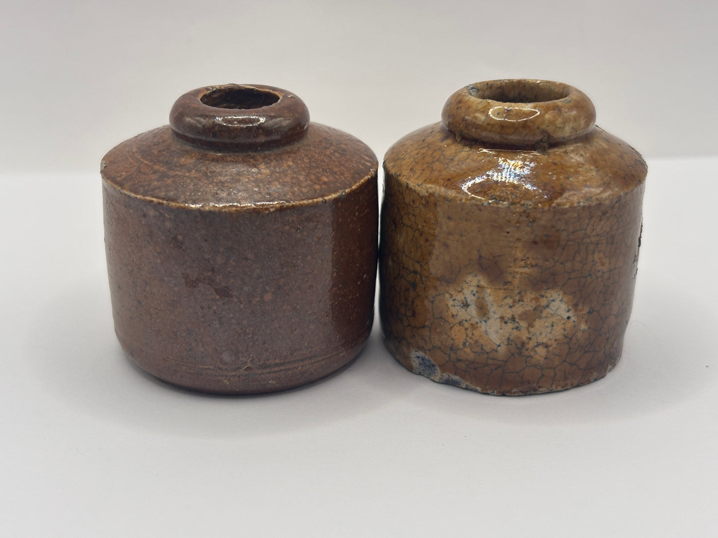 2 brown stoneware inkwells, ink bottles. Pork pie inks