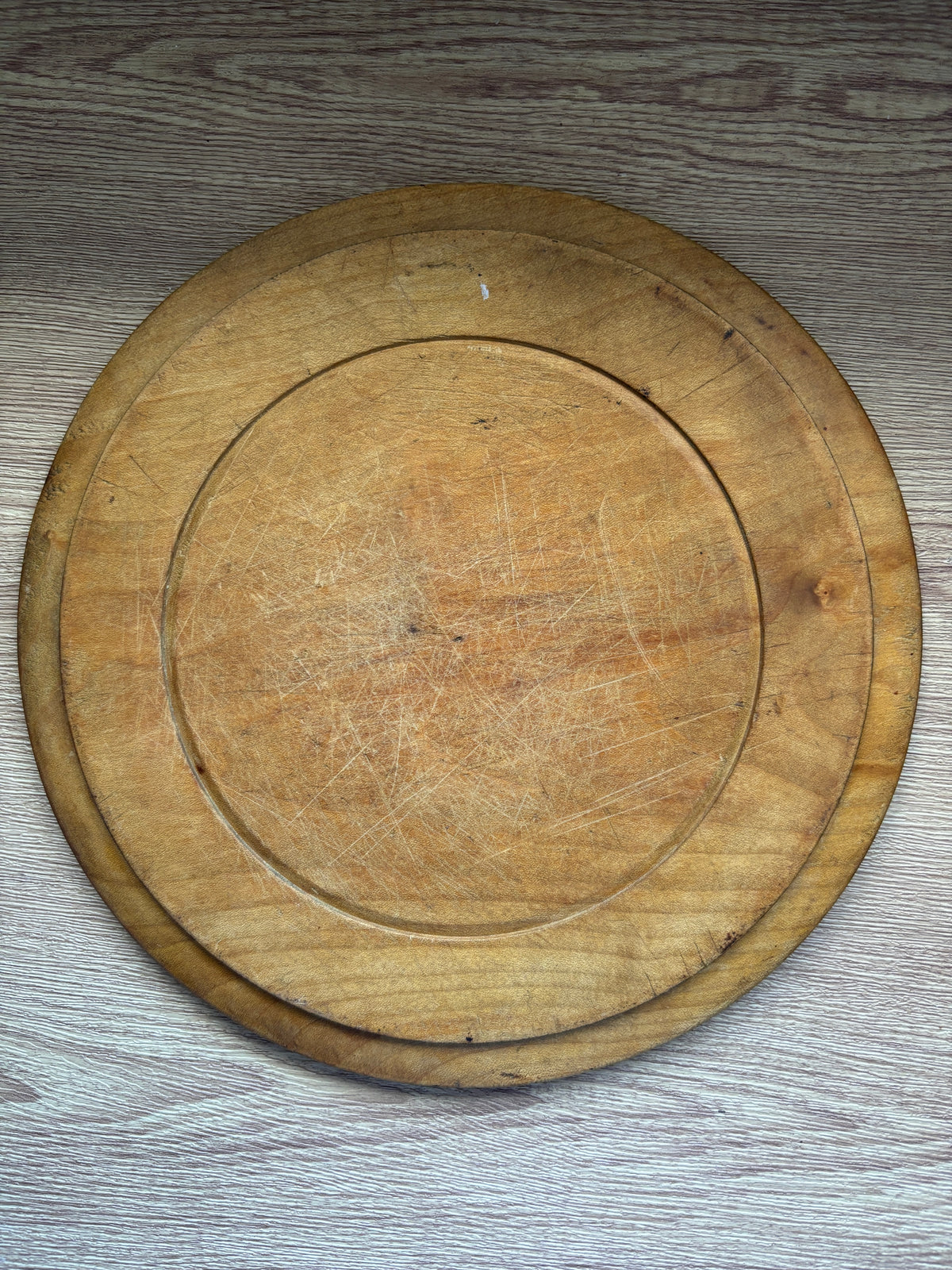 Old wooden carved bread board