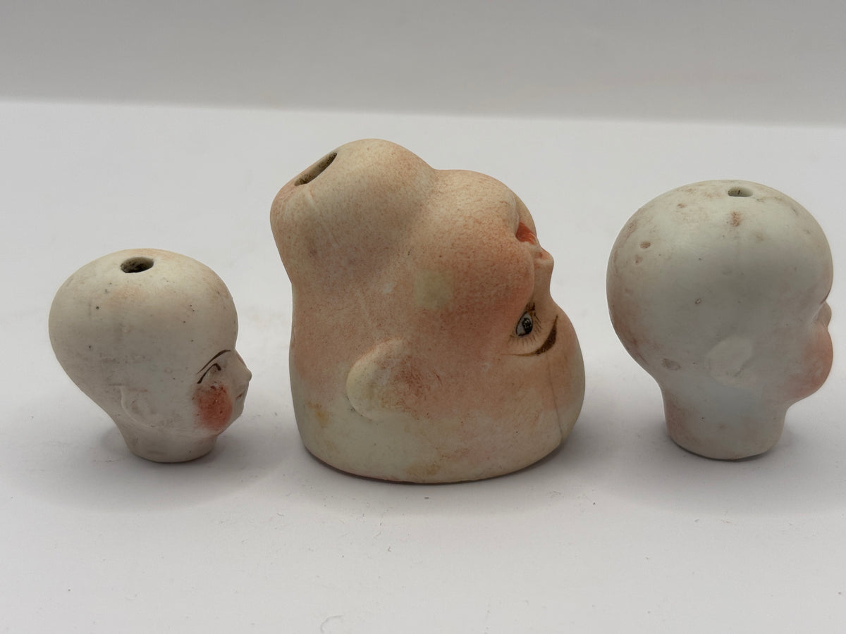 3 Old small bisque dolls heads