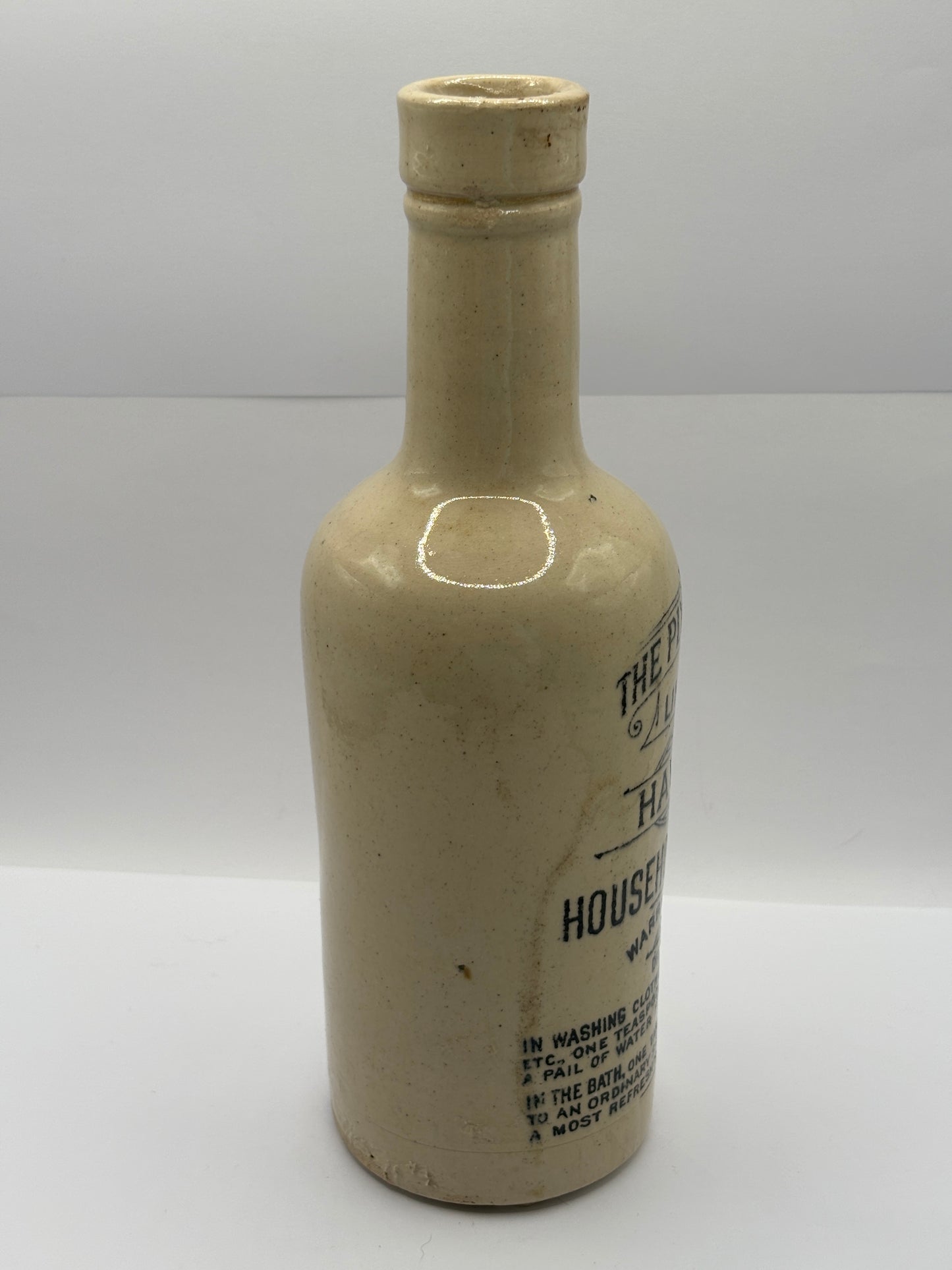 Old advertising stoneware bottle, Plynine household ammonia. Small size 21.5cms