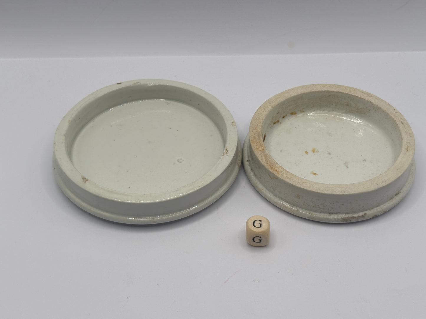 2 old plain stoneware lids (G)