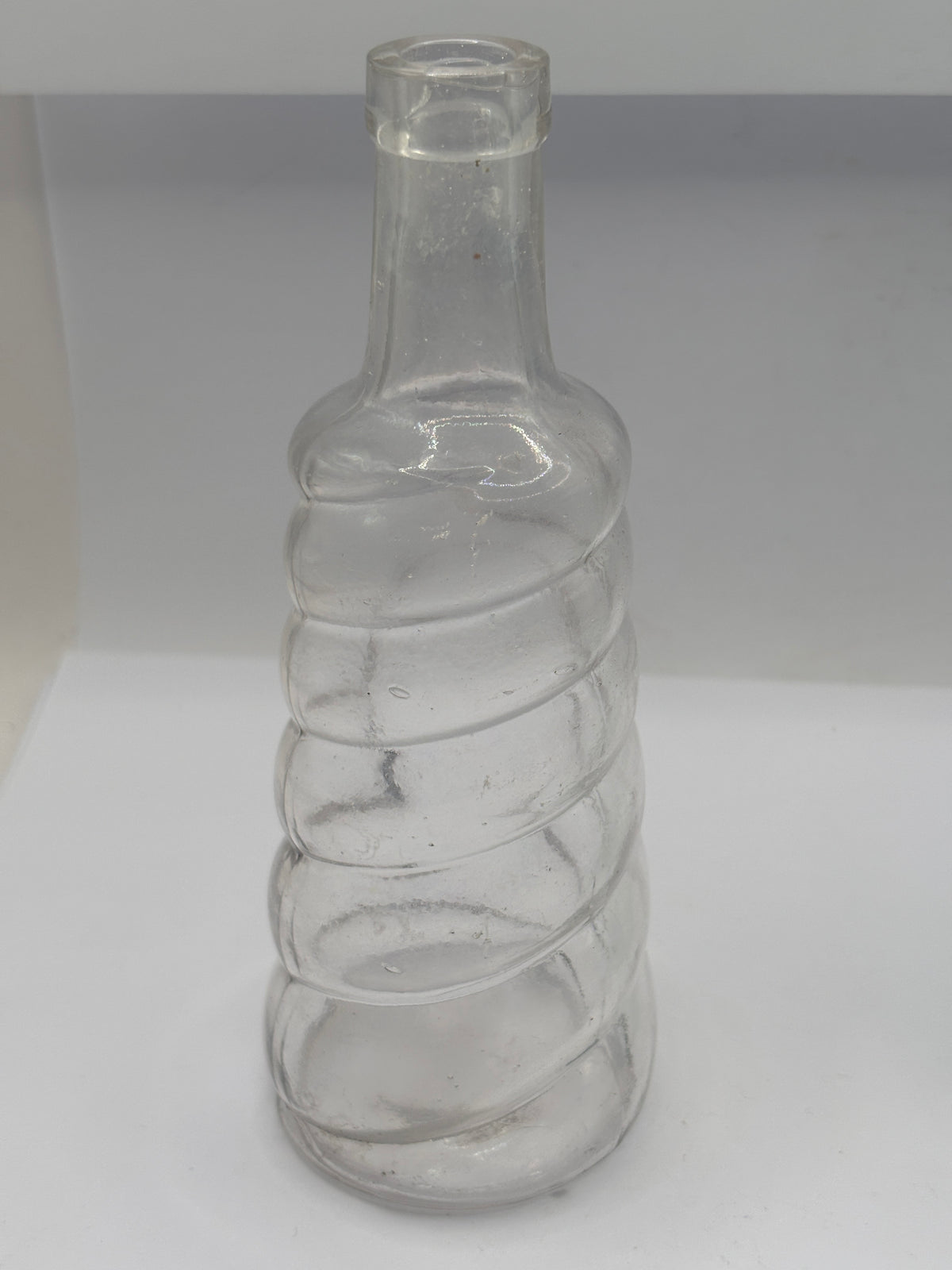Old clear glass bottle, soda?