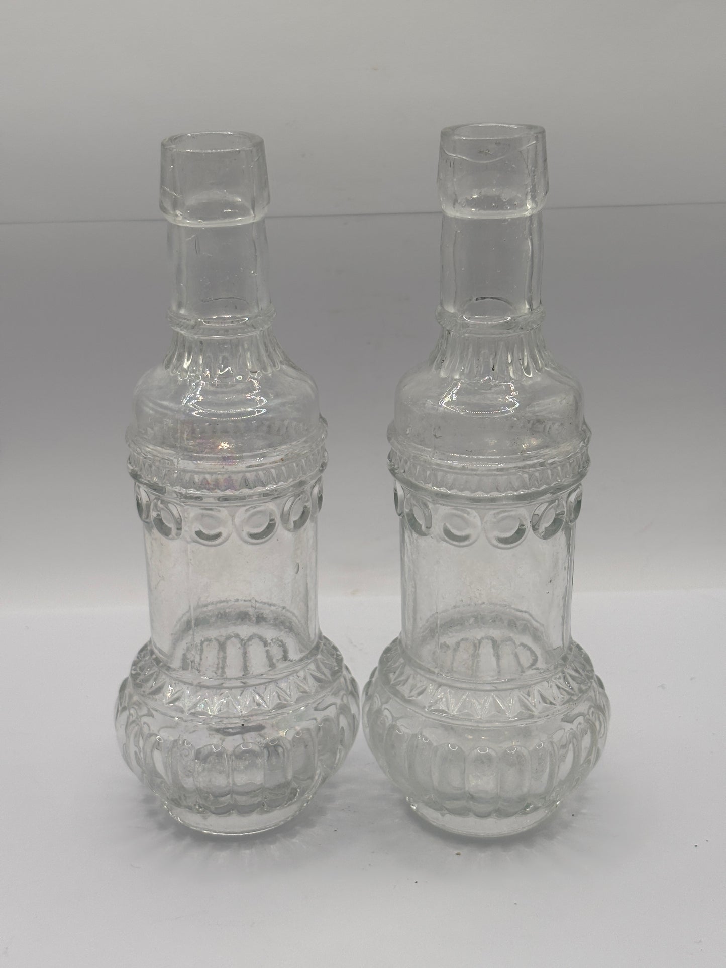 2 old clear glass bottles, soda?