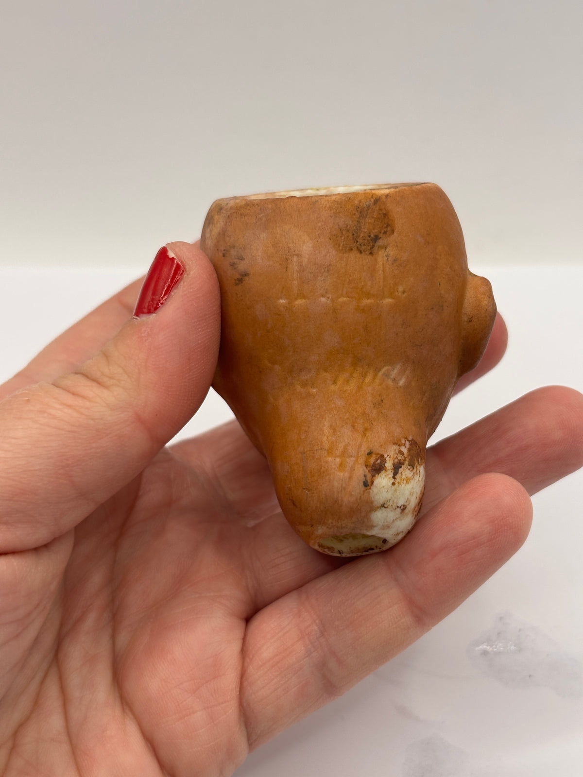 Old bisque dolls head, super stained