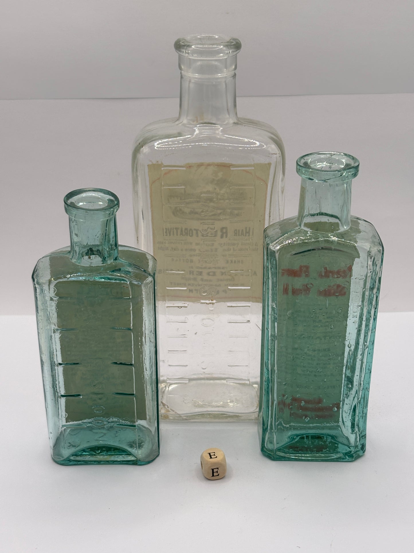 3 old chemist bottles with added labels (E)