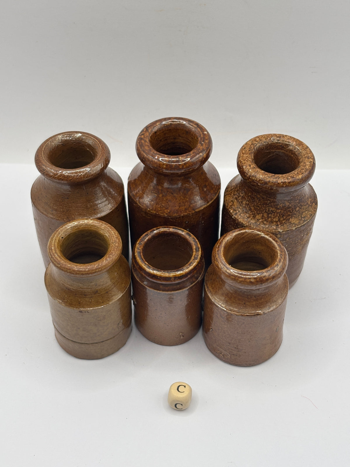 6 small brown stoneware pots (c)