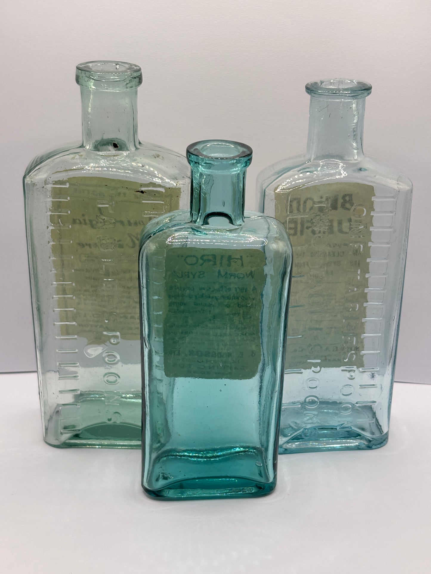 3 old chemist bottles with added chemist labels