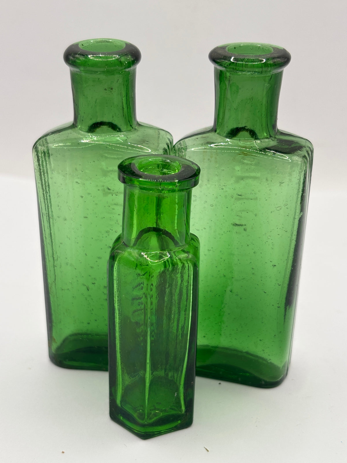 3 old small green ribbed poison bottles, not to be taken