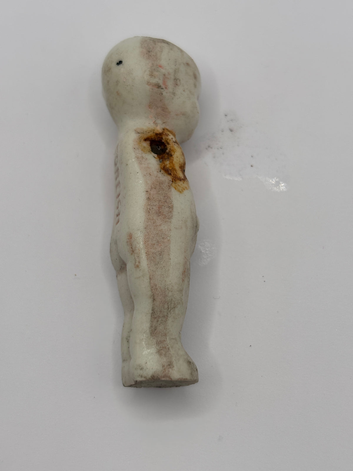 Old crusty small doll, armless