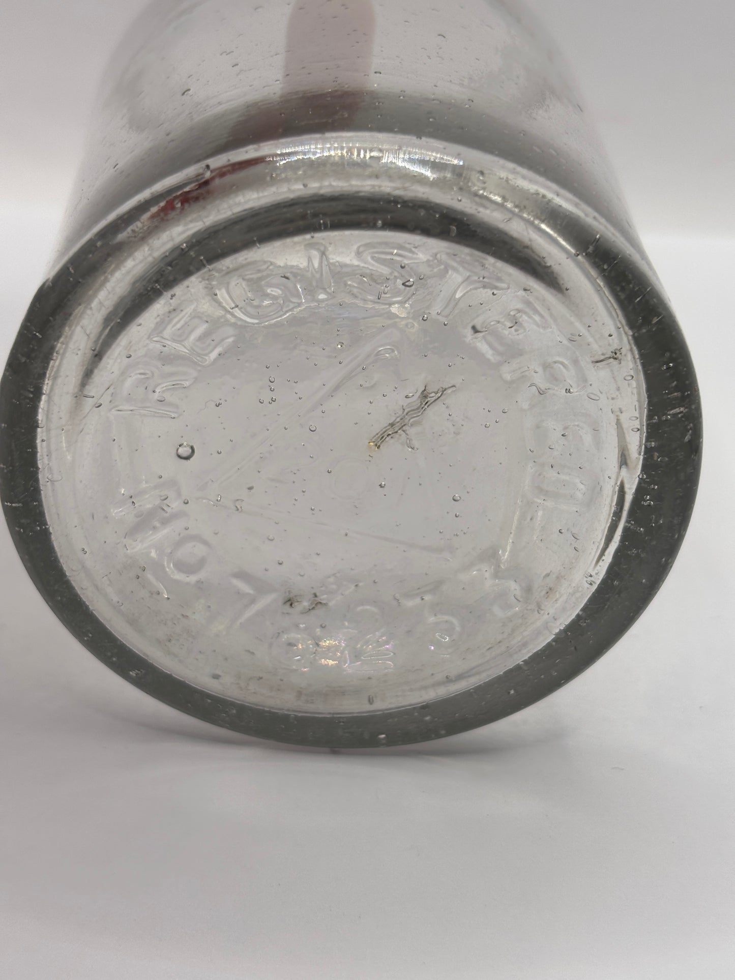 Old clear glass pickle jar
