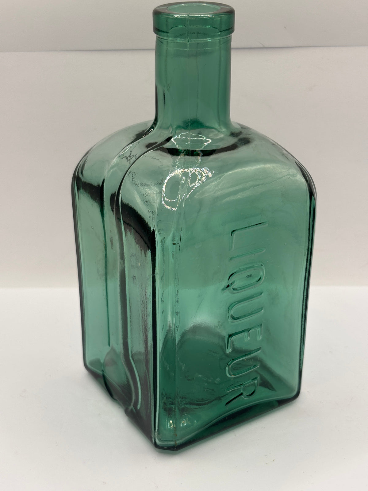 Old green liqueur bottle, contreau