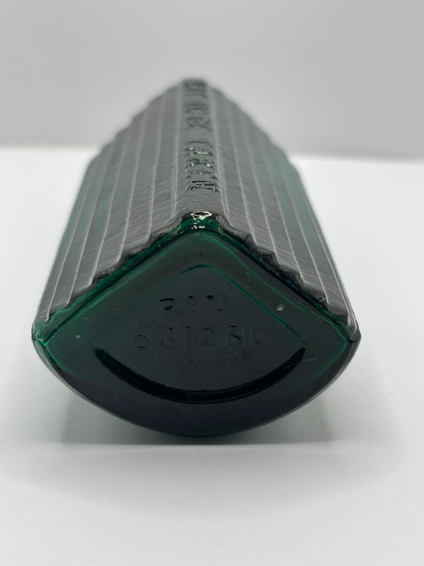 Old green glass poison bottle, not to be taken