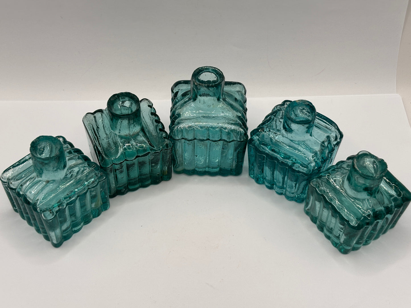 5 old glass ribbed inks, inkwells, ink bottles. Dark aqua