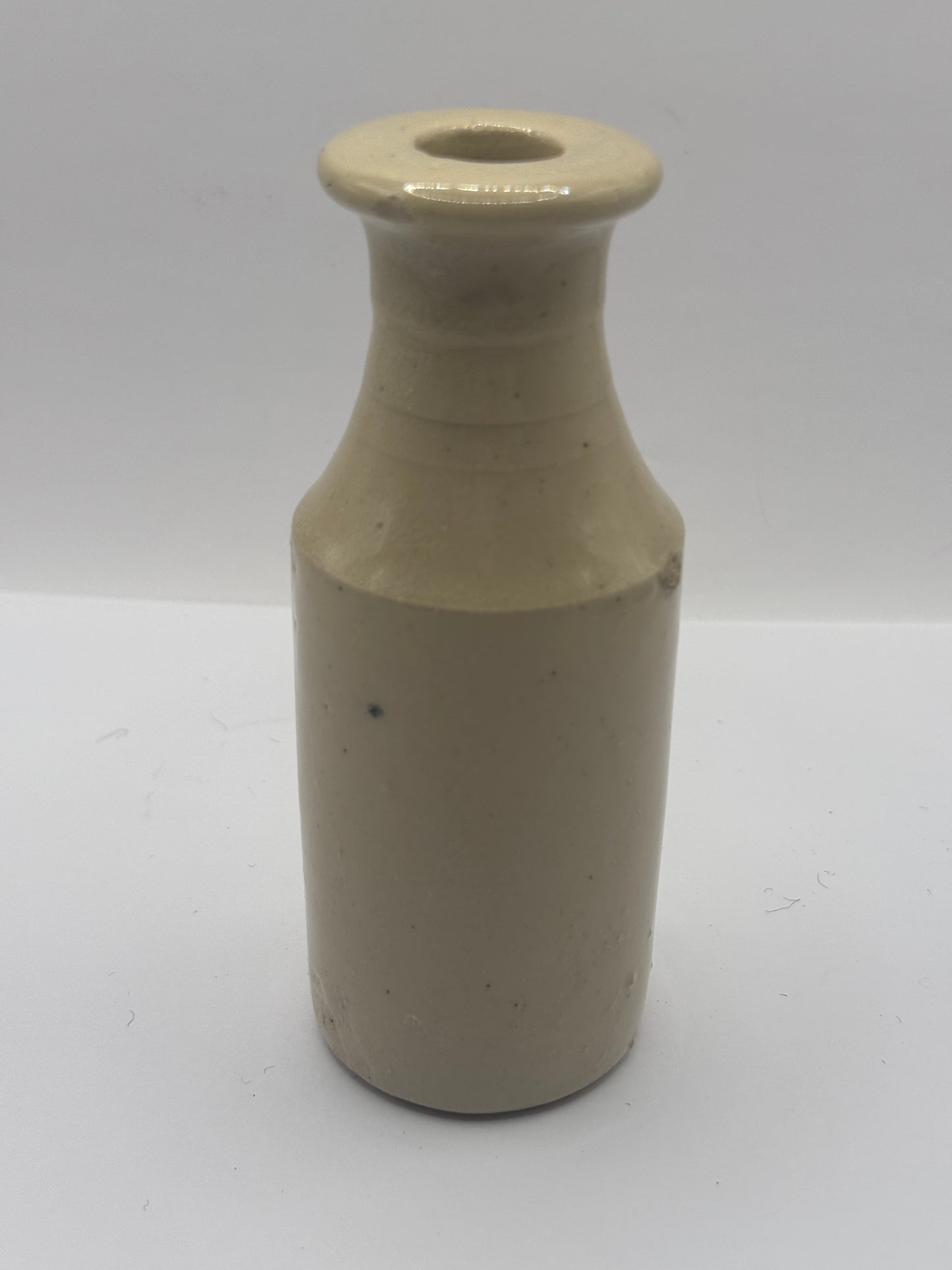 Old tall white stoneware bottle, ink? Polish?