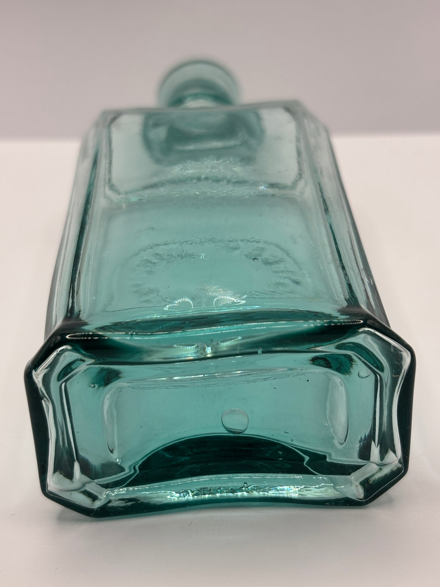 Old aqua glass advertising bottle. Perfume? Erasmic London Paris