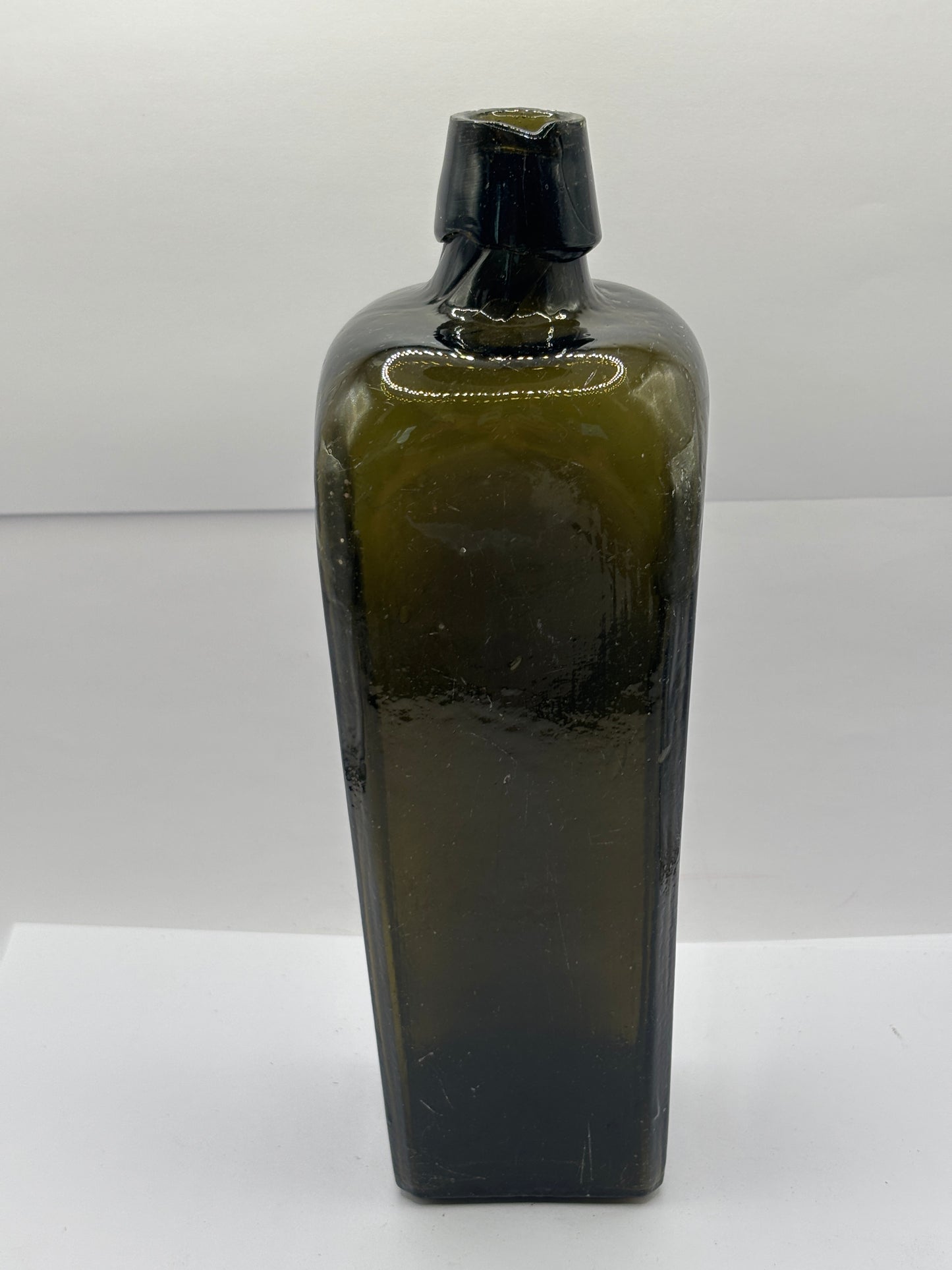 Old green glass gin bottle, case gin